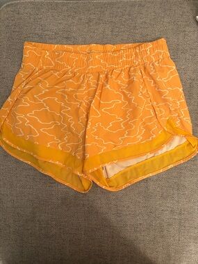 Athleta Orange Patterned Running Shorts